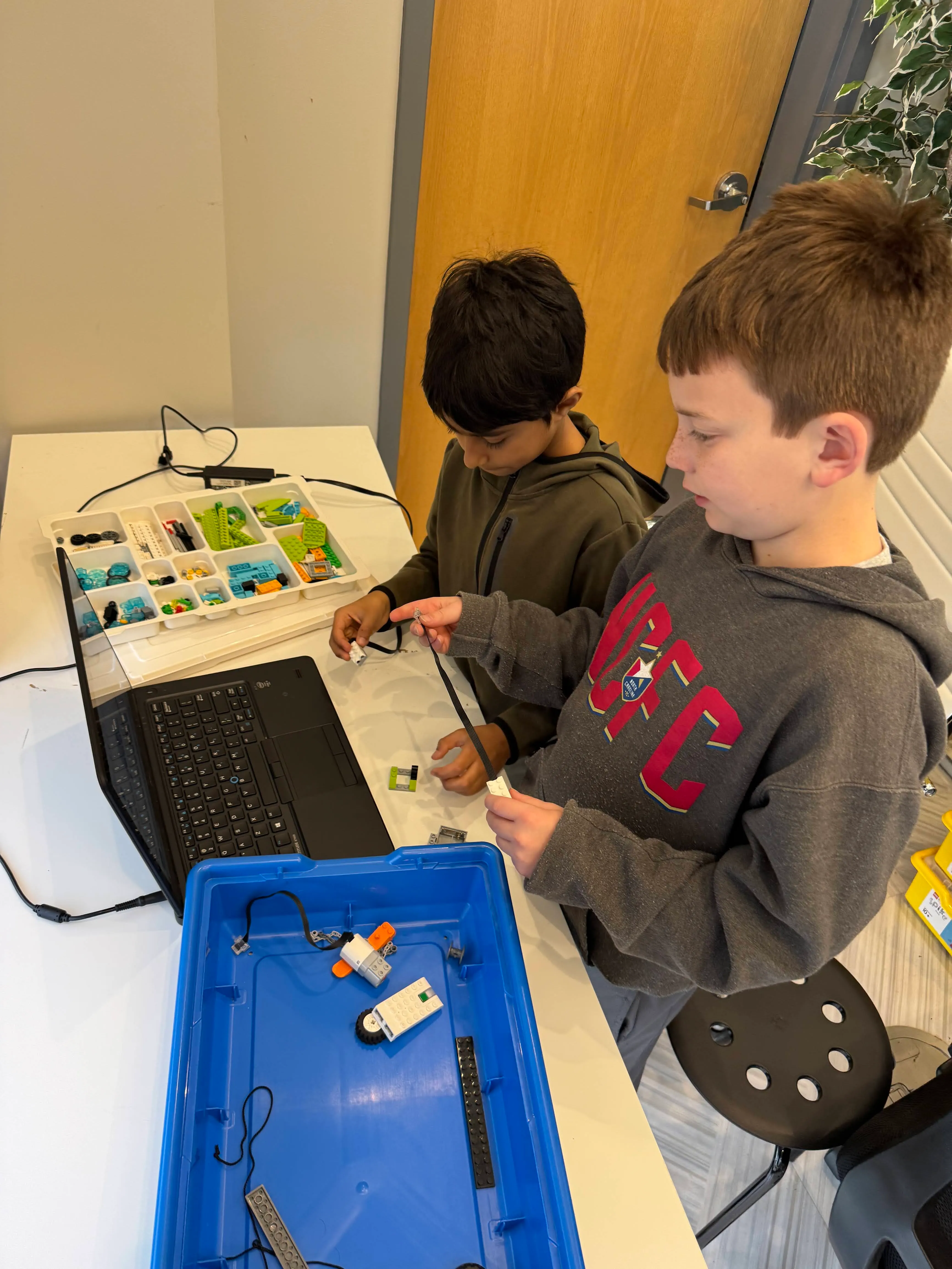 Students collaborating on a coding challenge