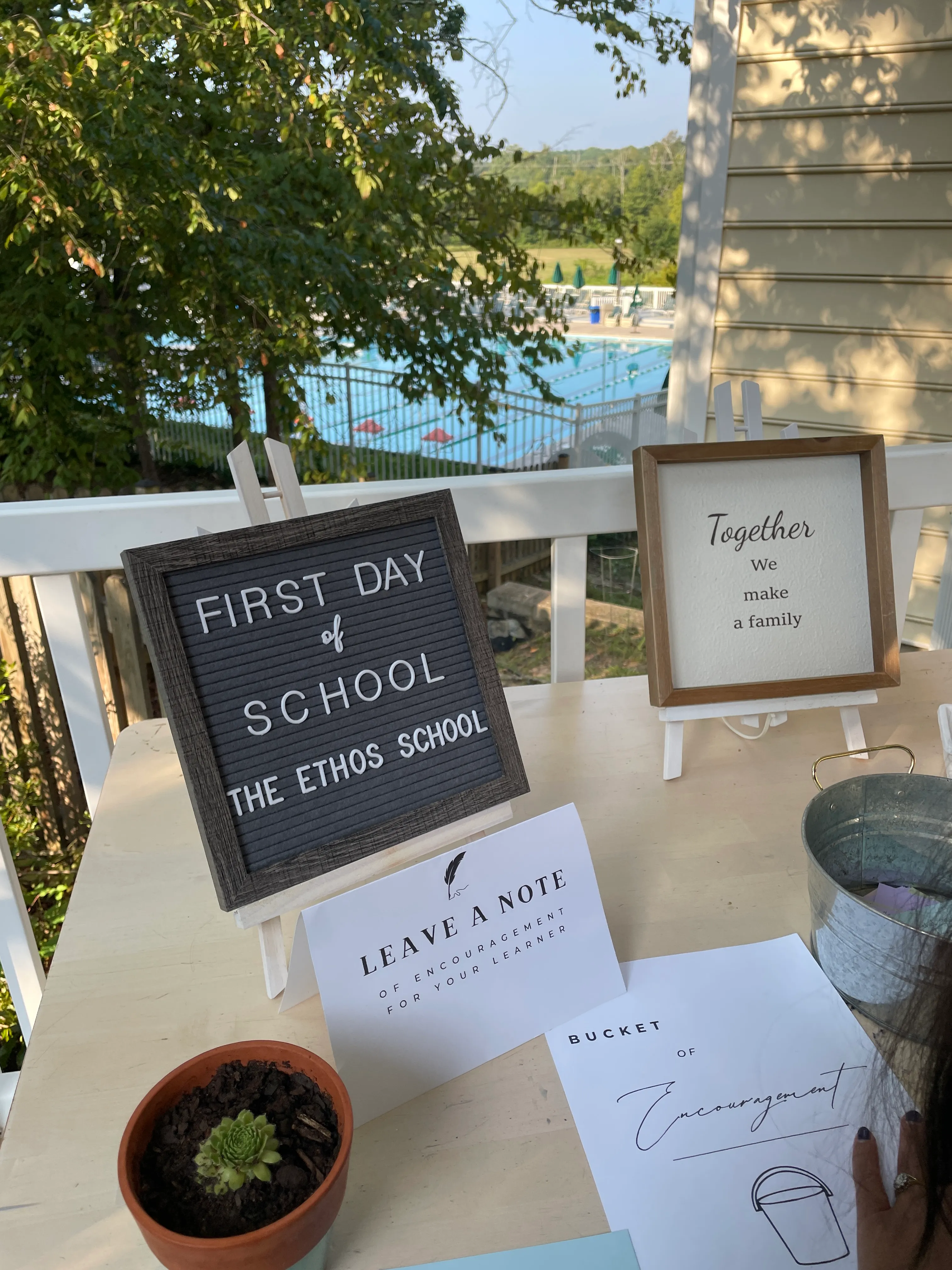 Parents and child learning together at The Ethos School